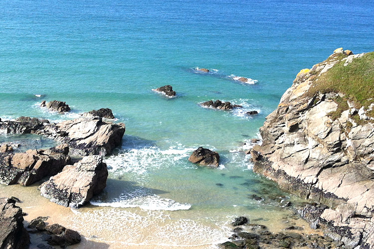 Newquay beach, rocks by the cliff