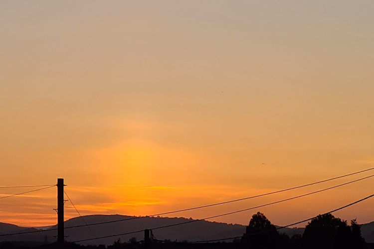 orange sunset looking across to Dartmoor